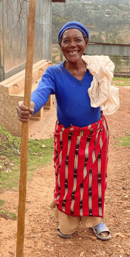a woman Farmer in a blue shirt and red pants