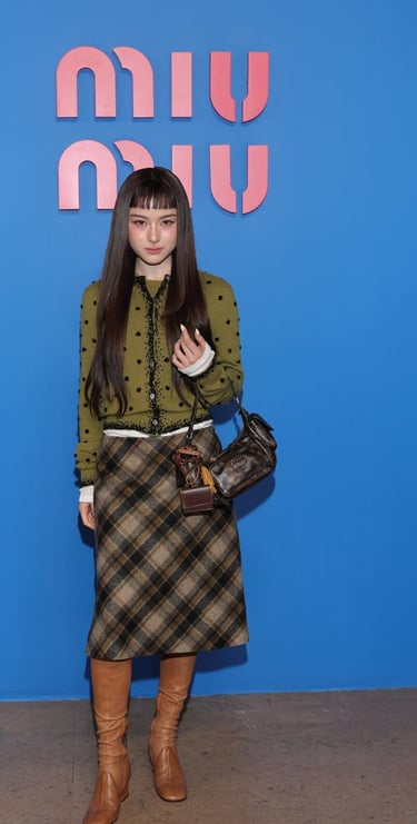 Prim Chanikarn at Paris Fashion Week 2026 in plaid.
