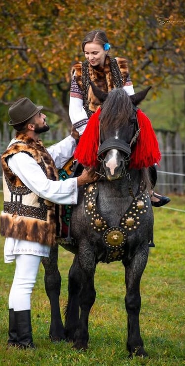 a woman in a costume is standing next to a horse