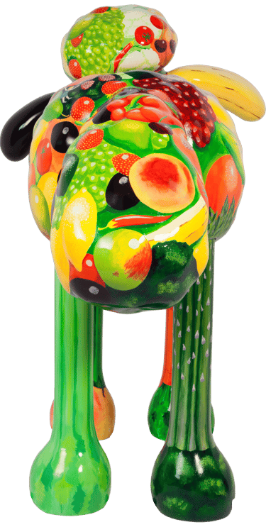 A large street sculpture od Shaun the Sheep painted with fruit and vegetables.