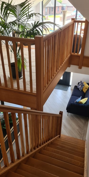 Bespoke architectural staircase design serving as a central feature in a modern home.