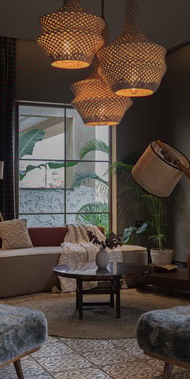 a living room with a couch and a lamp