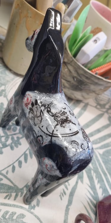 Our sugar skull Dala horse got all these pinholes on his saddle. We'll try again with him