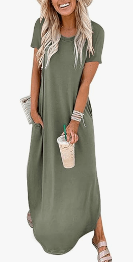 a woman wearing a green dress with a straw hat