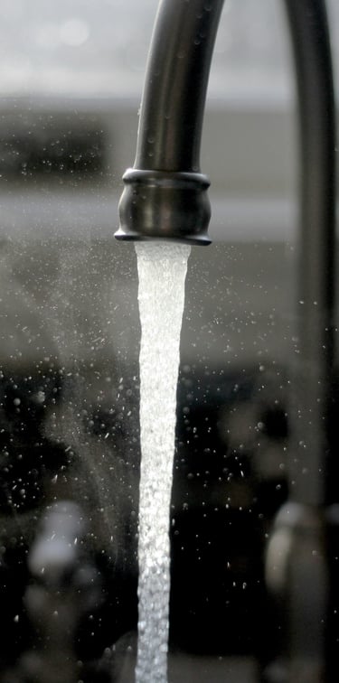 Black kitchen tap running water