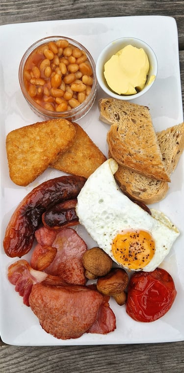 a plate of food with beans, toasted beans, toasted beans, and