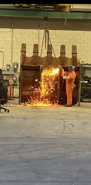 a man in orange overalls and a fire exting machine