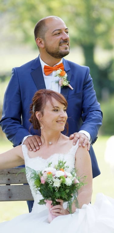 couple photography of bride and groom with flowers in burgundy