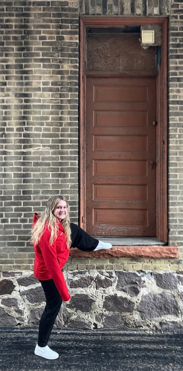 Girl outside of an alley door in Montello, Wisconsin