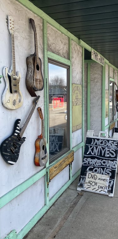 Guitars outside the door of a Main Street business in Wautoma, Wisconsin