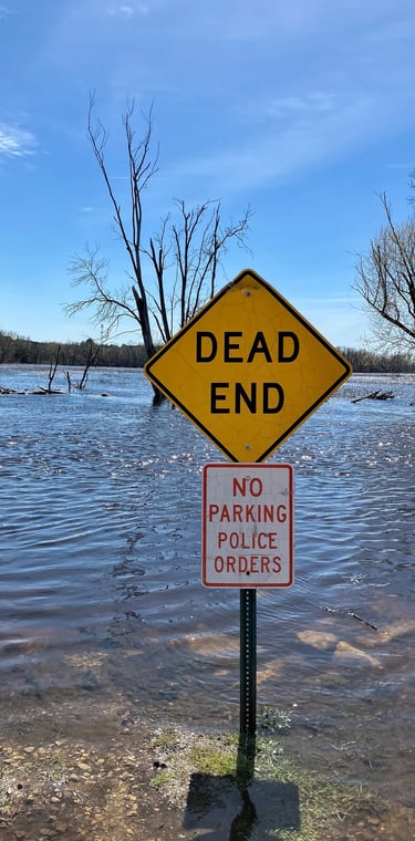 Dead End sign at edge of Fox River in Princeton, Wisconsin 
