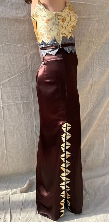 A gold brocade and brown satin evening gown