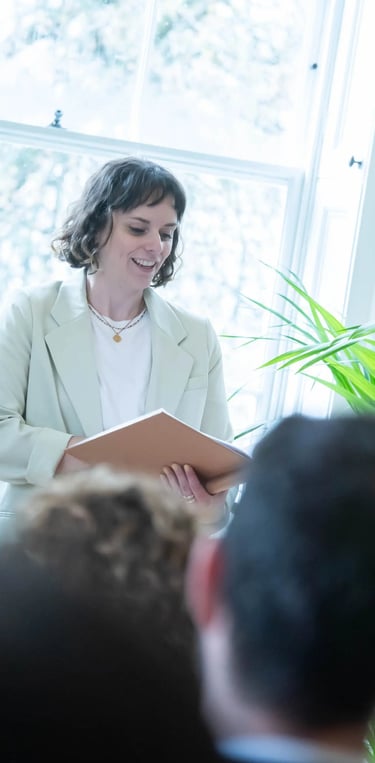a woman in a white suit and a man in a suit