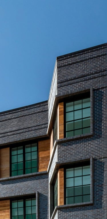 An architectural photo of a brick building with an angle