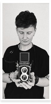 Portrait of the photographer Kaisa Tiits using analogue medium format camera Minolta Autocord.
