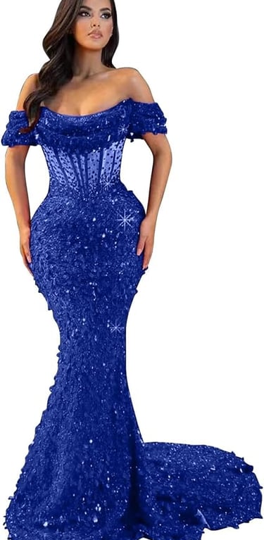 A woman models a dramatic, royal blue mermaid-style evening gown. It features an off-the-shoulder ne