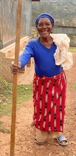 a woman Farmer in a blue shirt and red pants