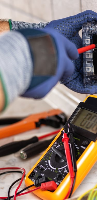 a person holding a multi-function tester