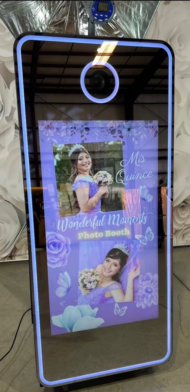 Girl in a purple quince dress with two photos displayed at a Quinceañera Mirror Photo Booth,