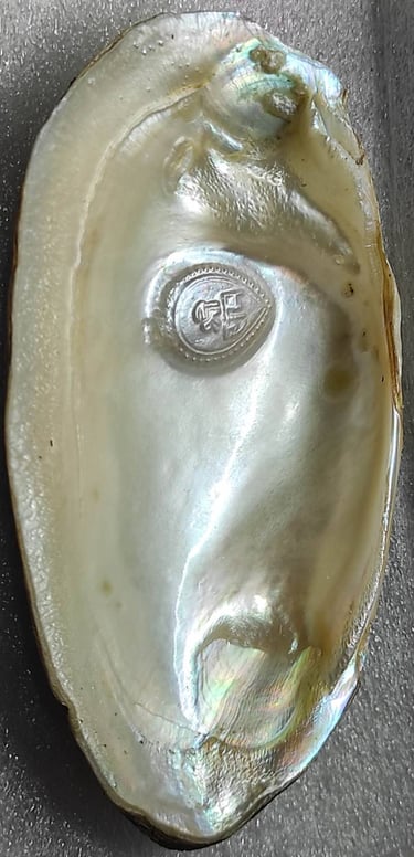 "Approx 11mm white cultured pearl featuring a divine face design–with nucleus implantation-for global shipment"