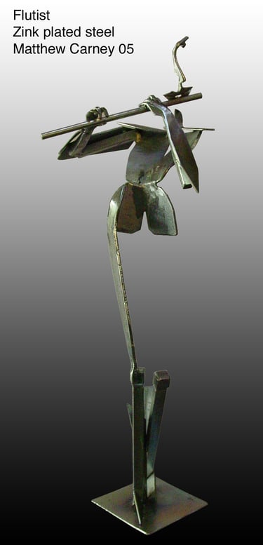 a sculpture of a man playing a flute
