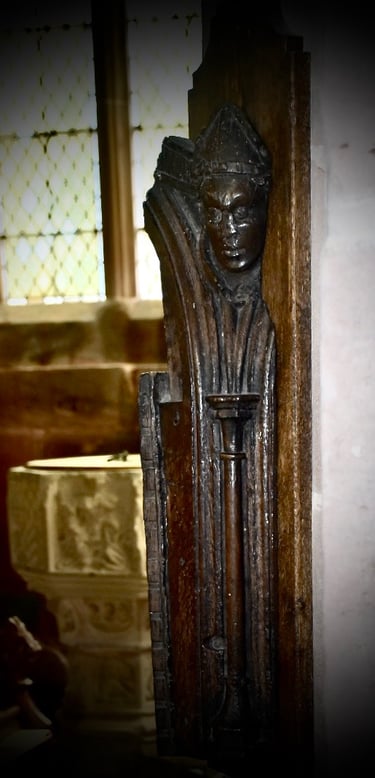 photograph of a wood carving of a man. 