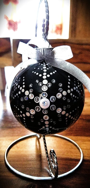Black Christmas Ornament with a snow flake with crystals.