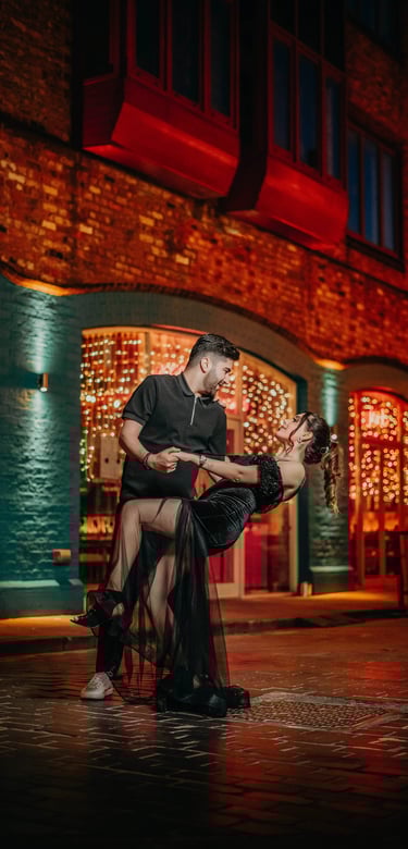 Couple dancing at night under warm streetlights in York, photographed by Fred Art Studio.