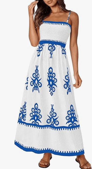 Women's white maxi sun dress with blue floral print and smocked bodice for summer fashion.