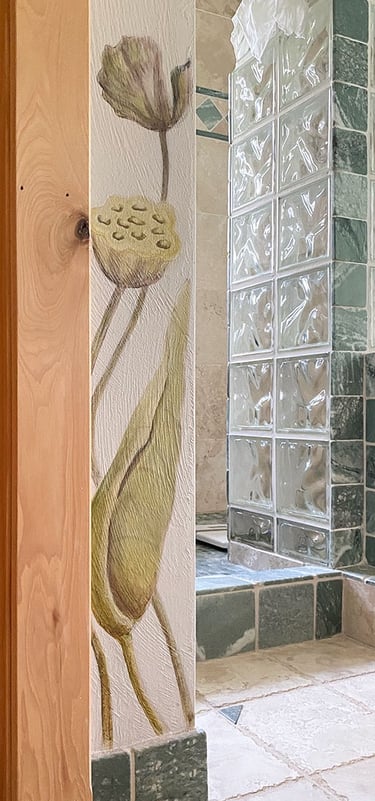 Detail of spa bath mural with 2 painted lotus seed pods on corner wall.