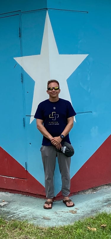 a man standing in front of a building with a large star on it