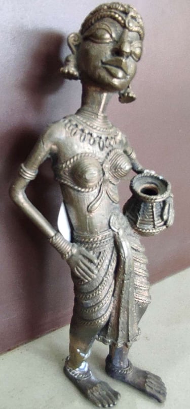 "Handcrafted tribal woman statue holding a water pot, standing in elegant pose-Globally tradable"