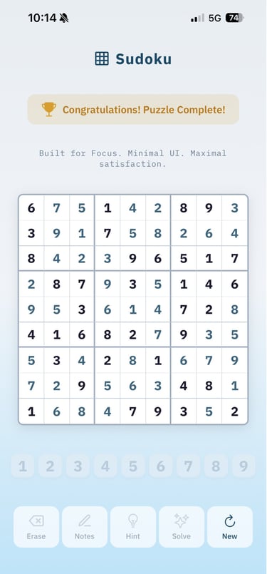 A completed Sudoku puzzle on a mobile app with a minimal UI and a congratulations message.