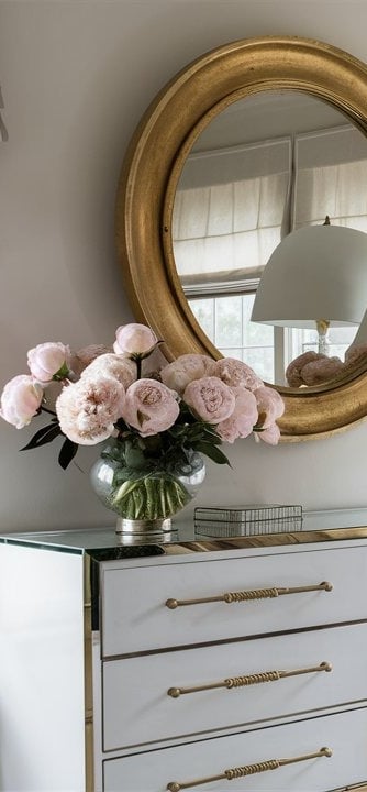 a bedroom with a large mirror and a large mirror