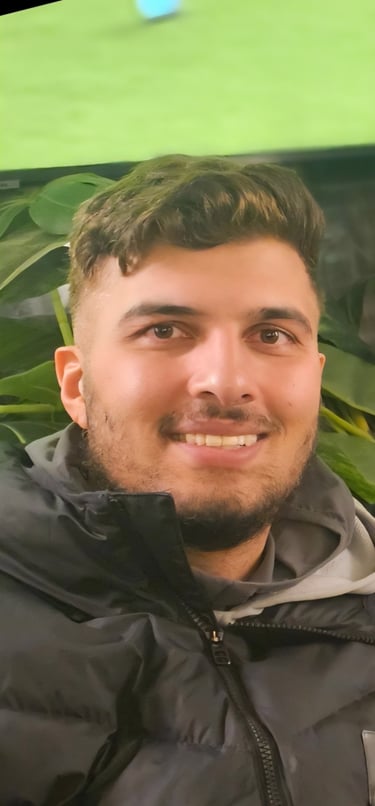 a man with a green umbrella in a green field