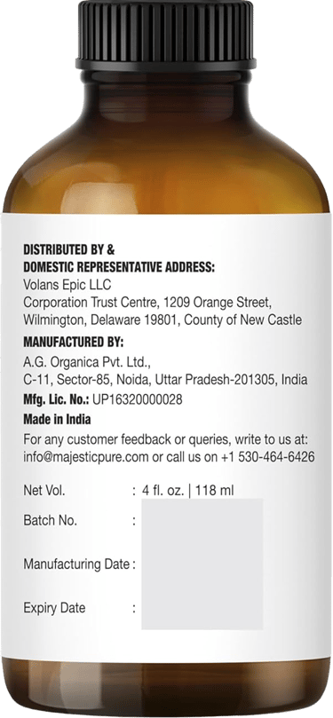 Brown bottle showing Majestic Pure lavender oil label with distributor, manufacturer, volume info
