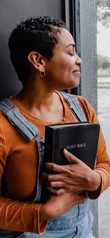 woman holding smiling from bible answers she got from bible