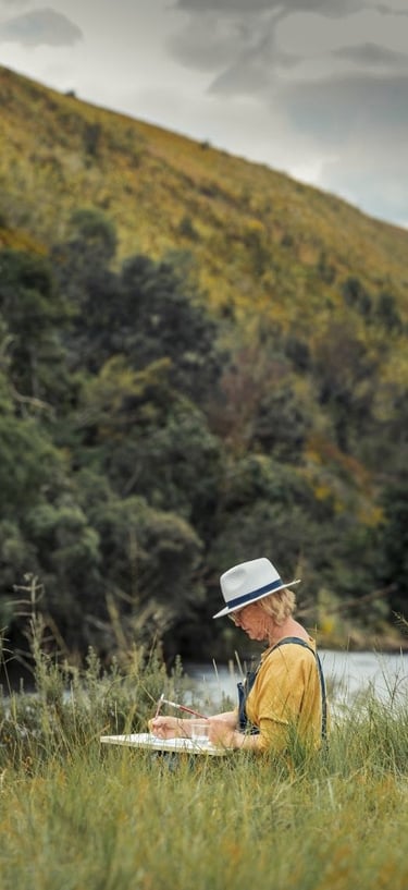 Artist painting outdoors at Swellendam Art and Photography Retreat.