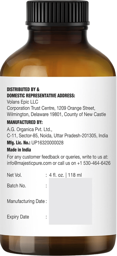 Brown bottle showing Majestic Pure lavender oil label with distributor, manufacturer, volume info
