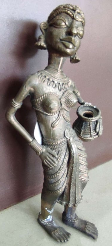 "Handcrafted tribal woman statue holding a water pot, standing in elegant pose-Globally tradable"