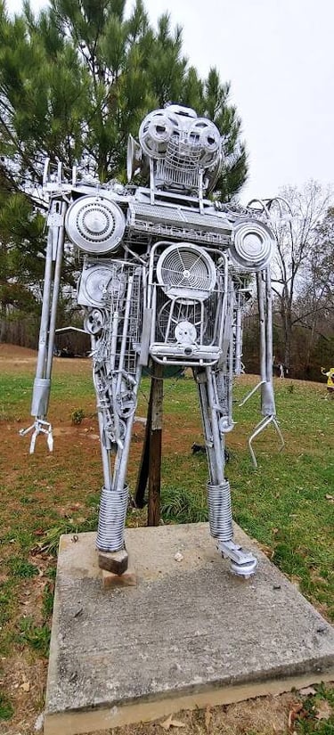 Mentone, AL - A robot made of metal parts on the road up the mountain