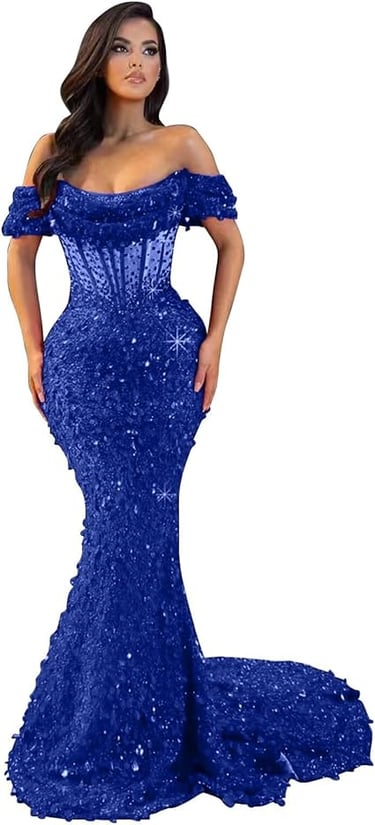 A woman models a dramatic, royal blue mermaid-style evening gown. It features an off-the-shoulder ne