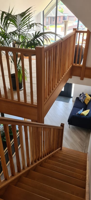 Bespoke architectural staircase design serving as a central feature in a modern home.