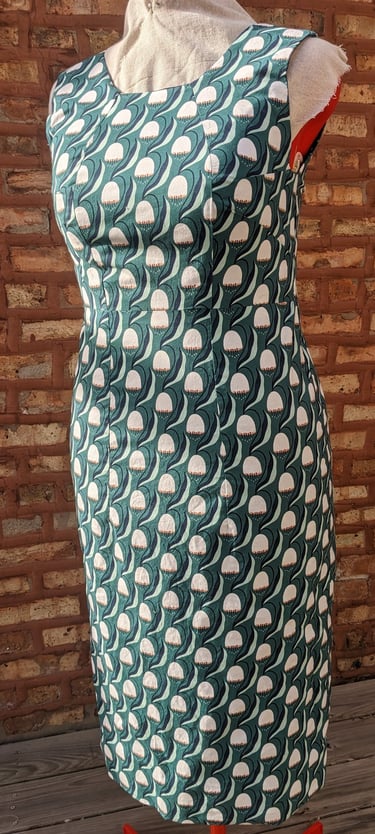 The front of a green art nouveau reversible sheath dress
