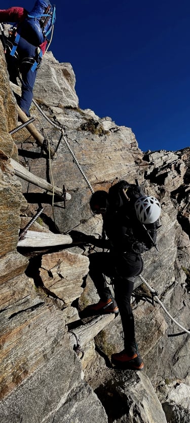 mais alhajri climbing a rocket mountain using a via ferrata route