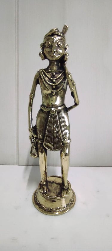 "Tribal farmer holding a plough in traditional attire–front view–handcrafted in brass-for export compliance