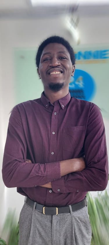 a man in a purple shirt and gray pants