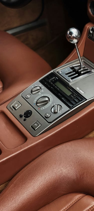a car dashboard with a clock and a clock on the dashboard