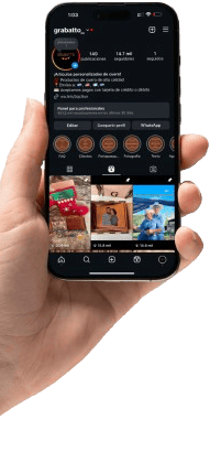 a person holding a cell phone in their hand