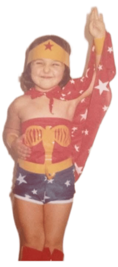 a young girl dressed in a wonderful woman costume